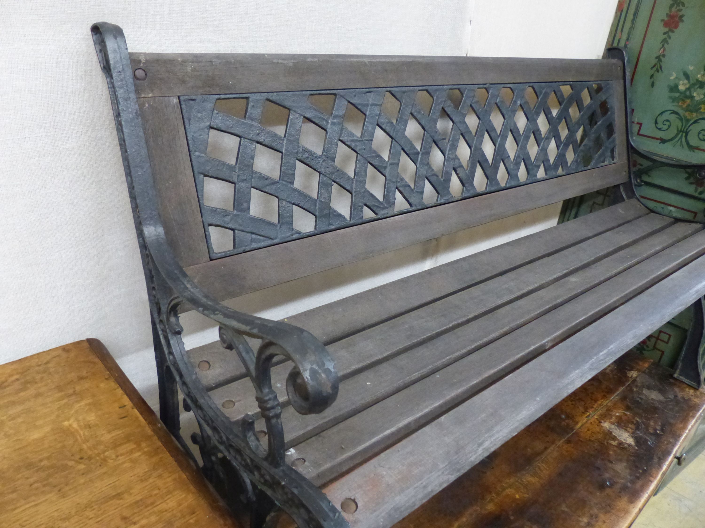 A painted cast metal garden bench, length 126cm, depth 52cm, height 80cm